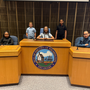 6 students from Pritchett Academy seated in Youth City Government
